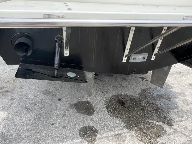 Rear view of a 2000 Stuart Angler 32 Center Console/Cutty boat, showing trim tabs and transom.