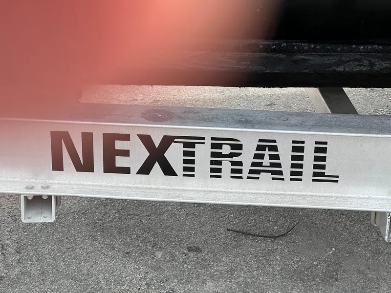 NextTrail trailer for Stuart Angler 32 Center Console/Cutty, 2000 model, on concrete surface.