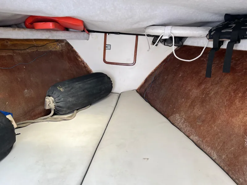 Interior of 2000 Stuart Angler 32 Center Console/Cutty boat with cushions and storage.
