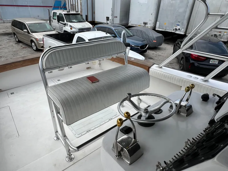 Stuart Angler 32 Center Console boat interior with steering wheel and seating, 2000 model.