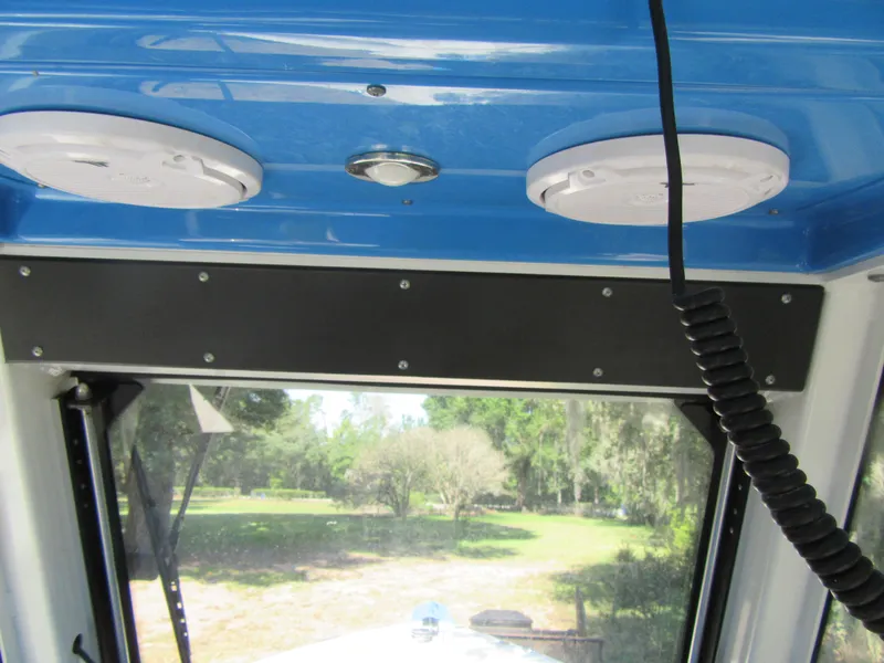 Interior view of 2017 Everglades 255 Center Console boat with speakers and microphone.