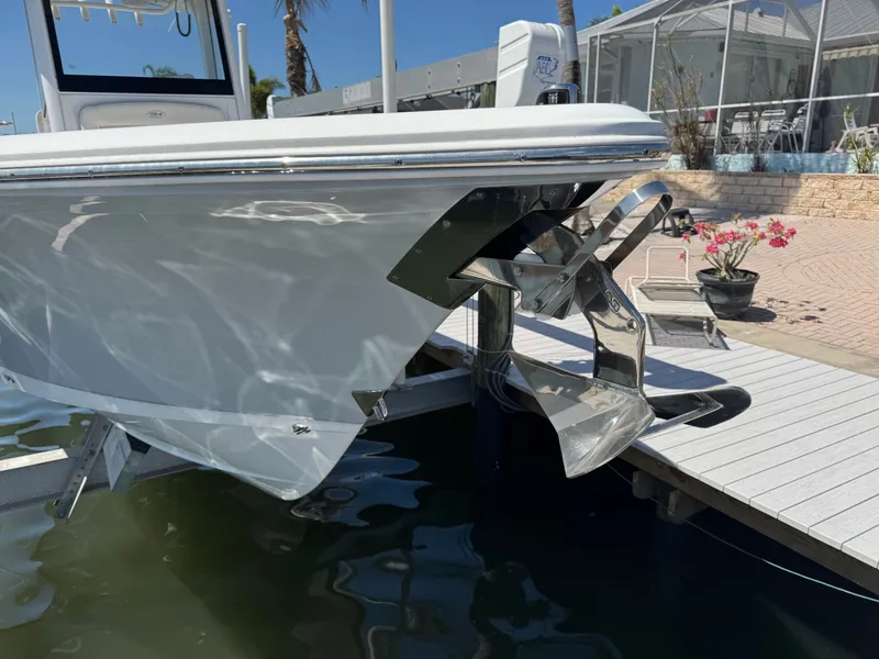 2024 Sea Hunt Gamefish 25 boat at dock with anchor.