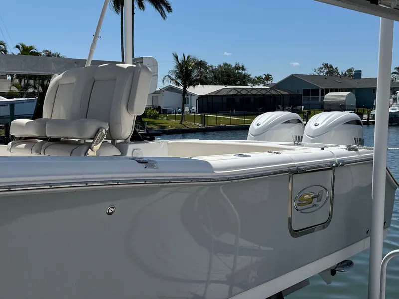 2024 Sea Hunt Gamefish 25 boat with twin engines at the dock.