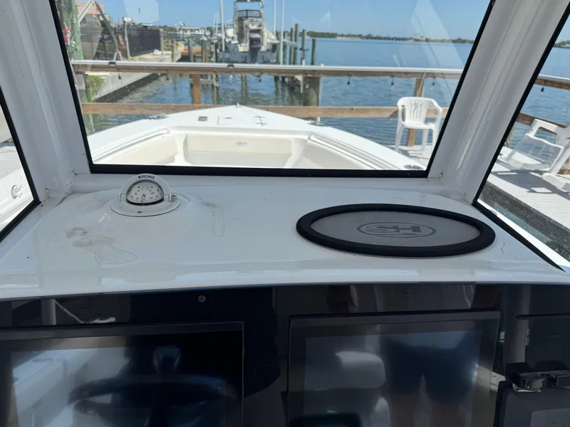 Interior view of a 2024 Sea Hunt Gamefish 25 boat at dock.
