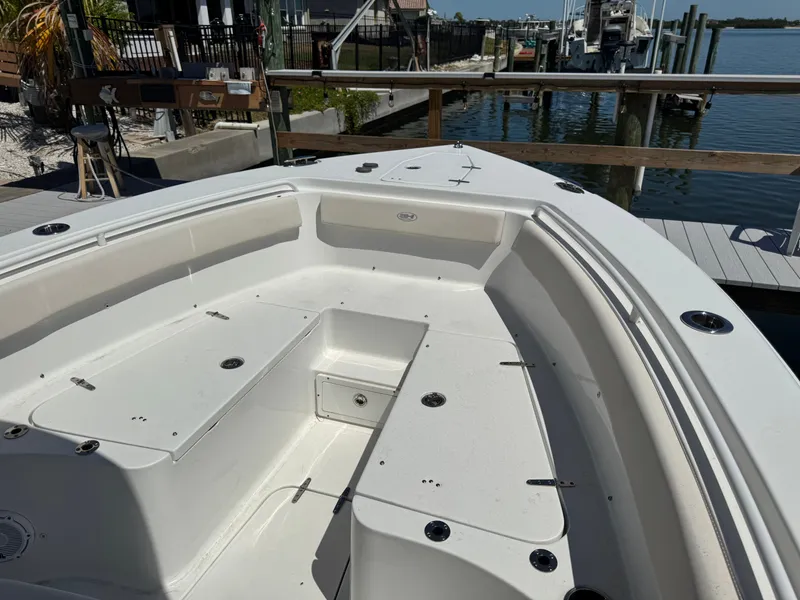 2024 Sea Hunt Gamefish 25 boat docked with spacious deck.