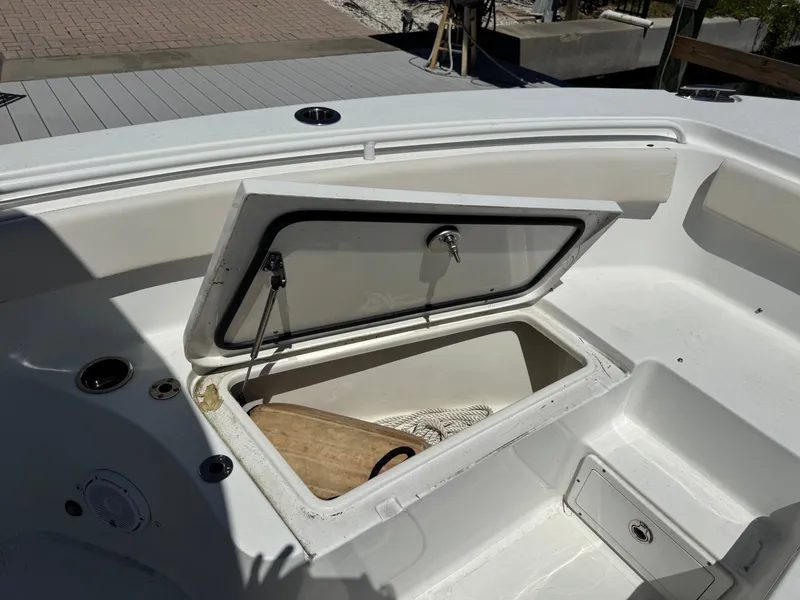 Open storage compartment on Sea Hunt Gamefish 25 boat, year 2024.