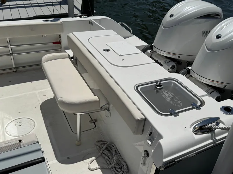 2024 Sea Hunt Gamefish 25 with dual engines and seating bench.