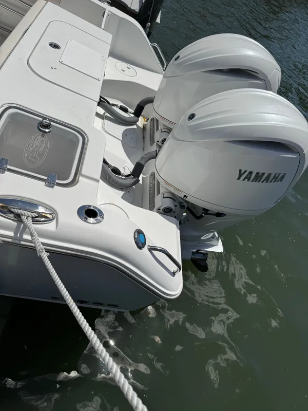 2024 Sea Hunt Gamefish 25 with Yamaha engines at dock.