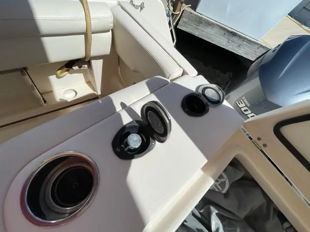 2017 Grady-White 300 Marlin boat interior with cup holders and engine controls.