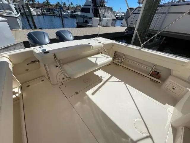2017 Grady-White 300 Marlin boat interior with docked yachts in the background.