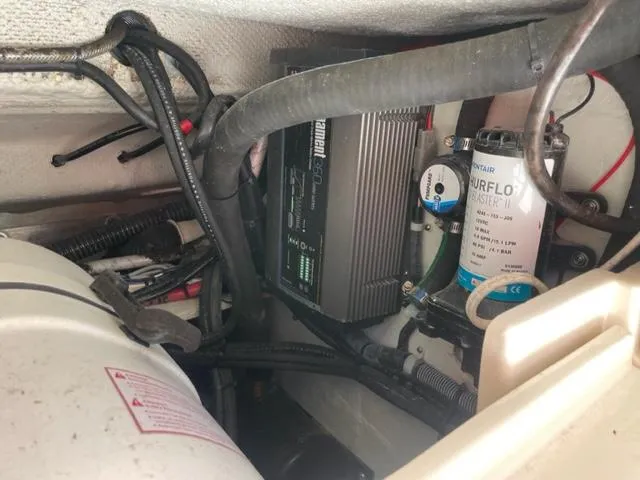 Engine compartment of a 2017 Grady-White 300 Marlin boat showing electrical and mechanical components.