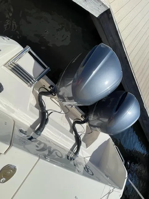 2017 Grady-White 300 Marlin boat with twin outboard engines docked.