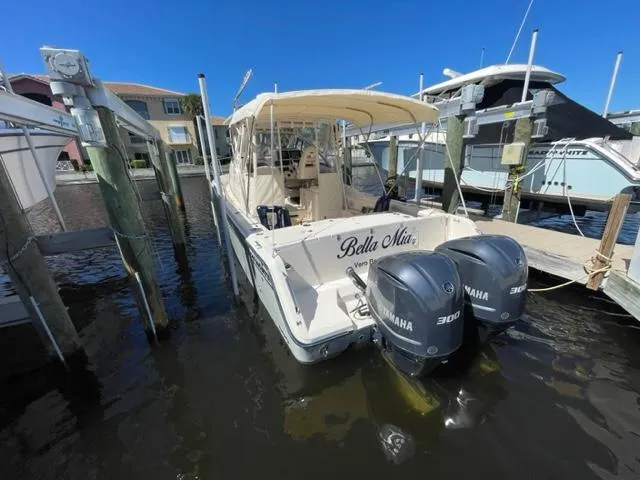 2017 Grady-White 300 Marlin boat docked with twin Yamaha 300 engines.