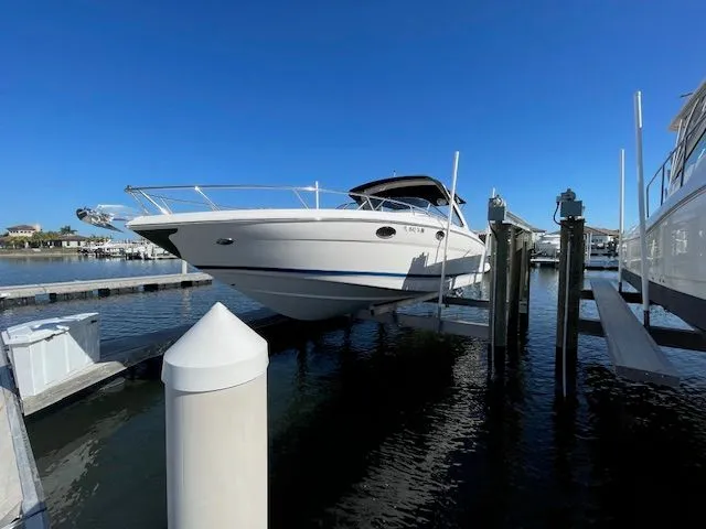2014 Regal 3550 Cuddy on a boat lift at the marina.