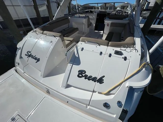 2014 Regal 3550 Cuddy boat with "Spring Break" lettering.