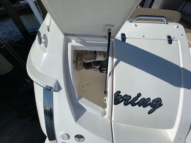2014 Regal 3550 Cuddy with open storage compartment at the stern.