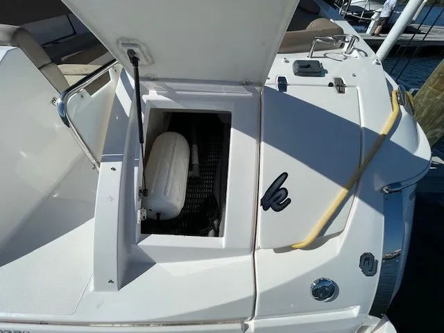 Regal 3550 Cuddy 2014 boat with open storage compartment.