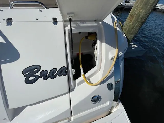 Regal 3550 Cuddy 2014 with open rear storage compartment.