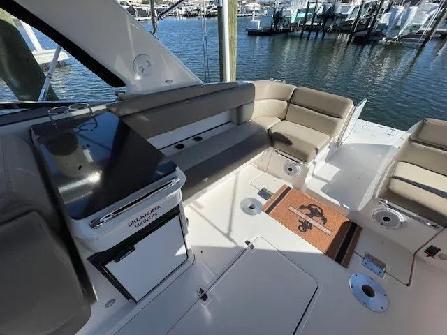 Interior of a 2014 Regal 3550 Cuddy boat with seating area.