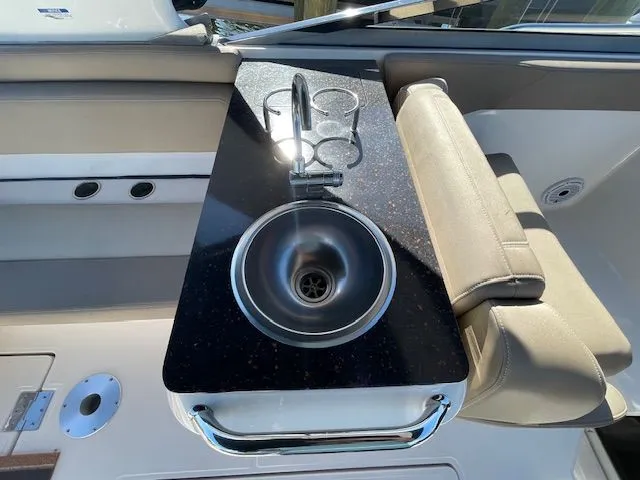 2014 Regal 3550 Cuddy with sink and cup holders.