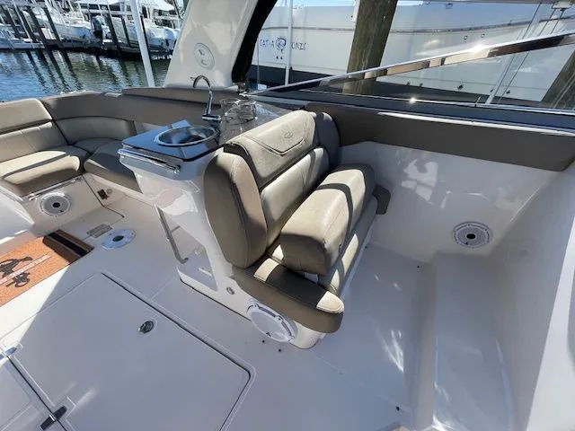 Interior of a 2014 Regal 3550 Cuddy boat with seating area.