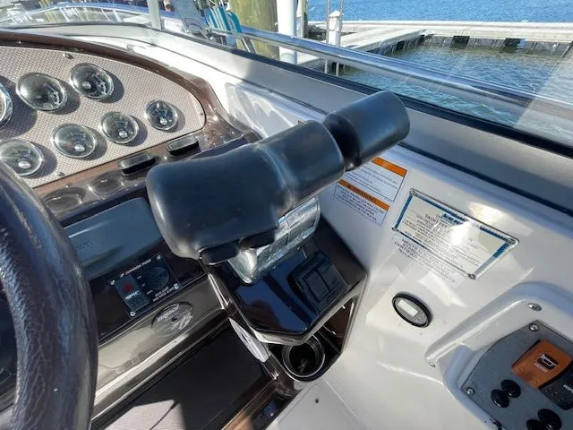 Helm console of a 2014 Regal 3550 Cuddy boat at the dock.