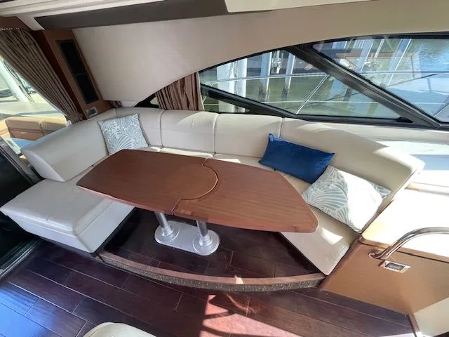 Interior of a 2016 Sea Ray 510 DA yacht with elegant seating area.