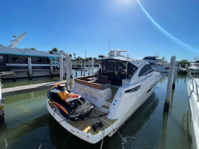 2016 Sea Ray 510 DA yacht docked with jet ski.
