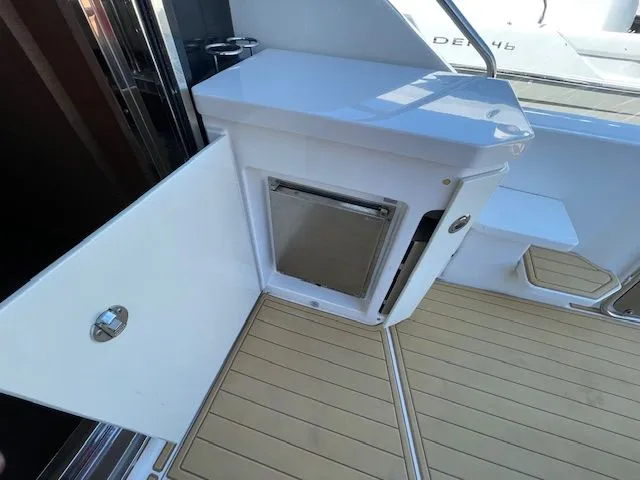 Interior of a 2016 Sea Ray 510 DA yacht with open door.