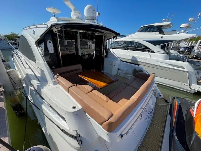 Luxury Sea Ray 510 DA 2016 yacht docked, featuring a comfortable seating area.