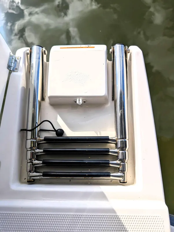 2022 Cutwater C-32 Coupe LE swim platform with retractable ladder.