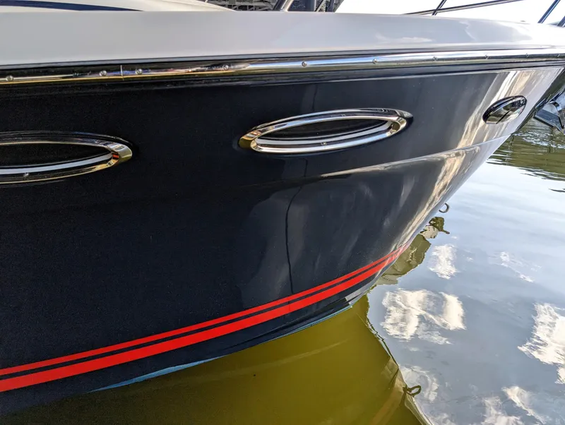 2022 Cutwater C-32 Coupe LE boat hull with red stripe detail.