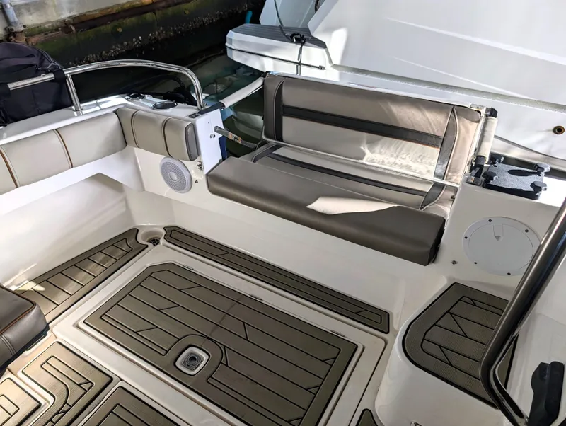 2022 Cutwater C-32 Coupe LE boat interior with cushioned seating and teak flooring.