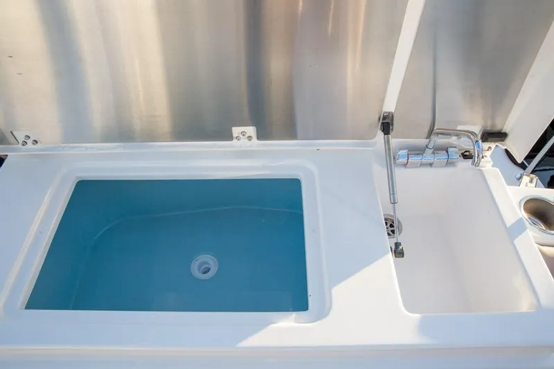 2022 Cutwater C-32 Coupe LE boat sink and storage compartment.