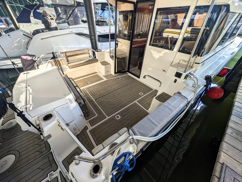 2022 Cutwater C-32 Coupe LE boat interior, docked, with open cockpit and modern design.